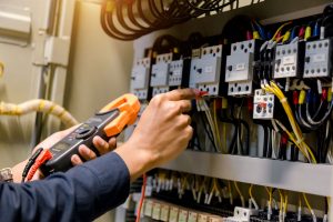 electrician checking electrical wires